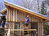 Putting on the siding.